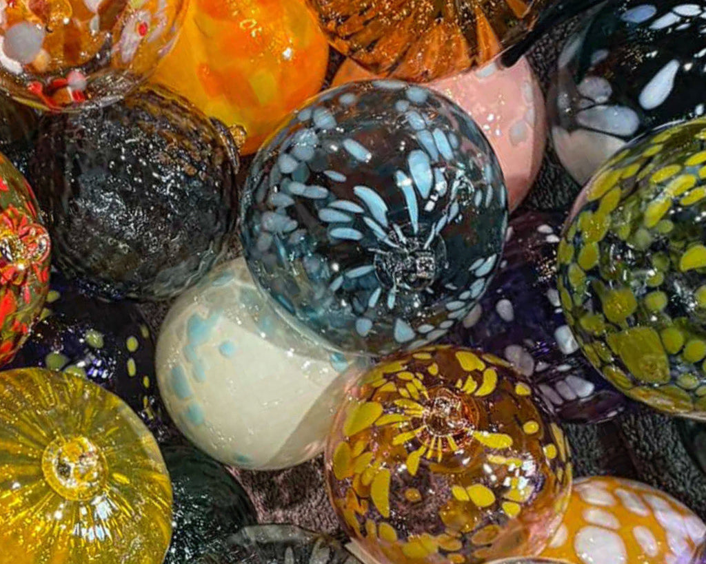 Collection of colorful glass marbles with various patterns