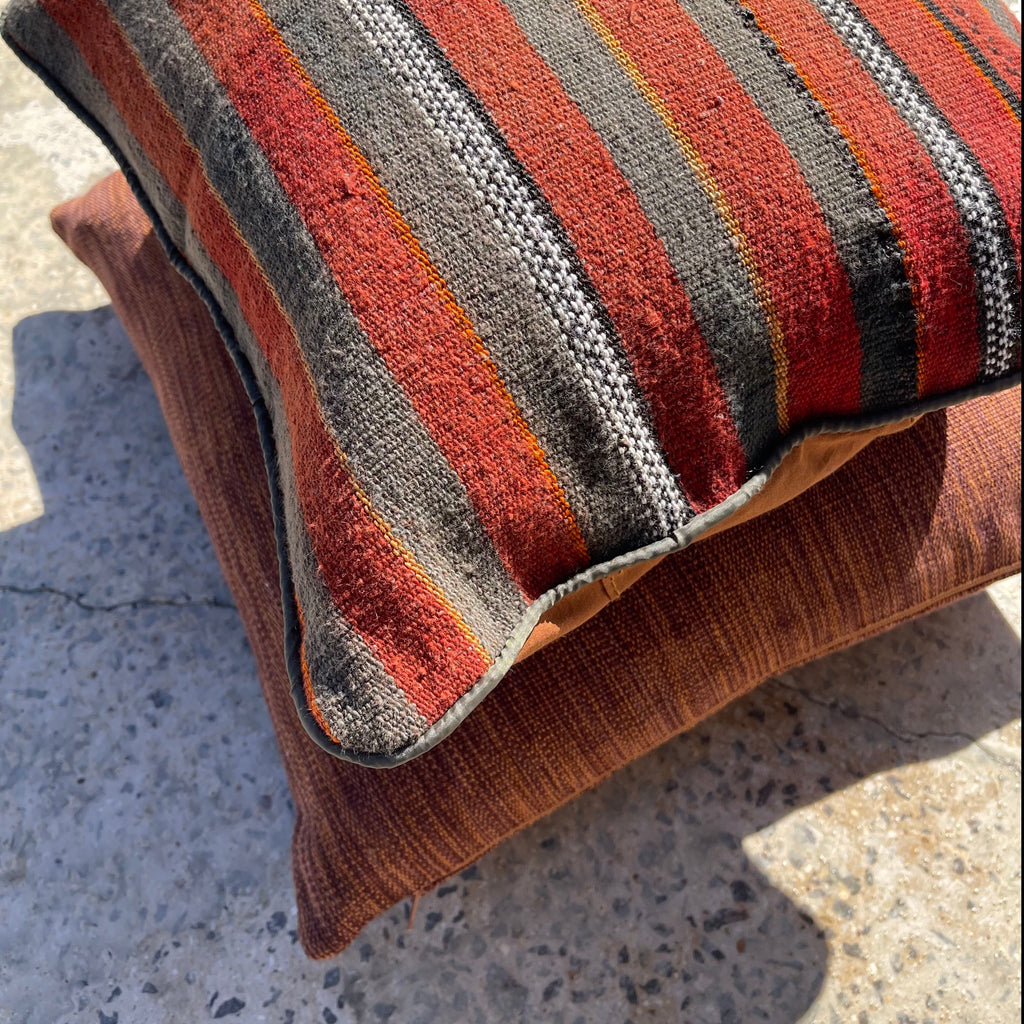 Burnt cyana dalitsho cushion featuring Afgan cushion. Handwoven in Guatemala. Designed by Woven.