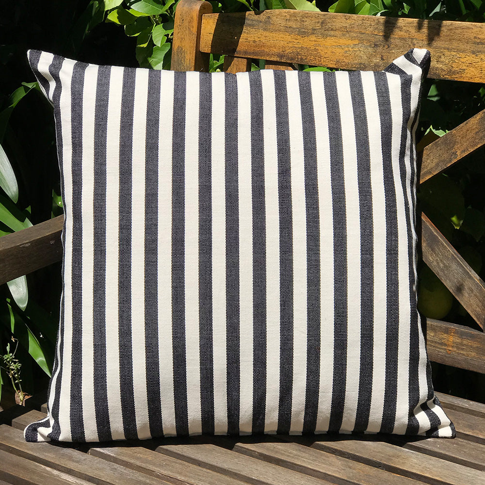 Jenna cushion. Black and white stripes made with 100% organic cotton and natural dyes. Designed by Woven. Handmade in Guatemala.