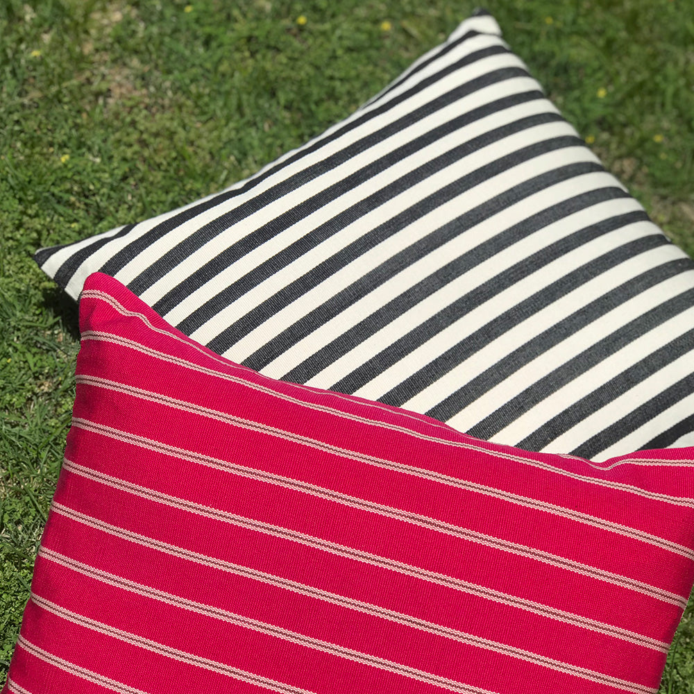 Jenna cushion. Black and white stripes made with 100% organic cotton and natural dyes. Featuring Jodie cushion. Designed by Woven. Handmade in Guatemala.