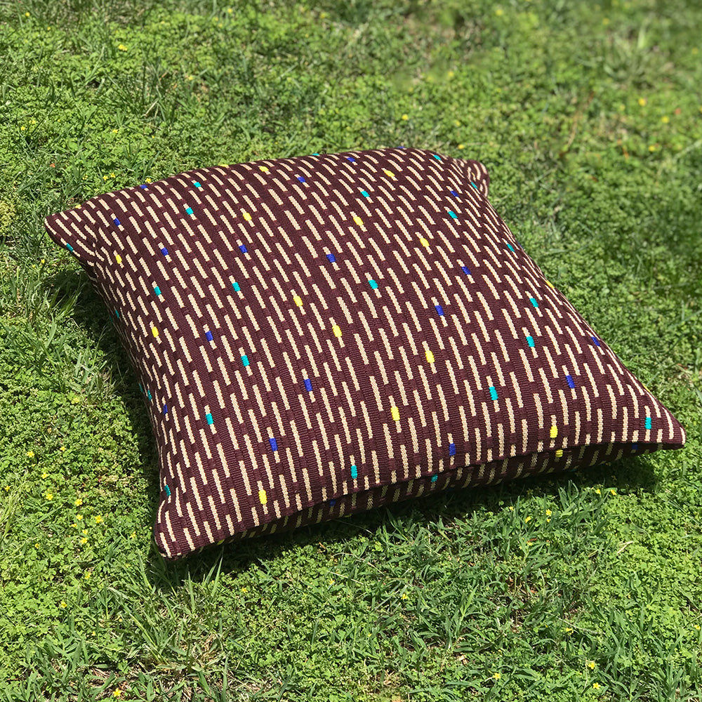 Kate cushion. Brown with yellow rain drop design made with 100% organic cotton and natural dyes. Designed by Woven. Handmade in Guatemala.