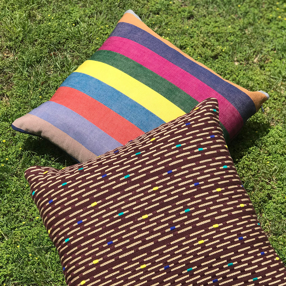 Kate cushion. Brown with yellow rain drop design made with 100% organic cotton and natural dyes. Featuring Chloe cushion. Designed by Woven. Handmade in Guatemala.