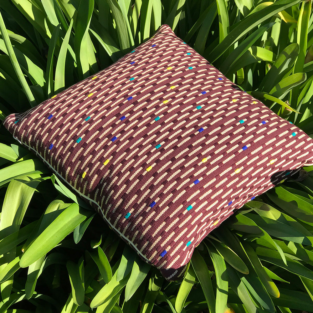 Kate cushion. Brown with yellow rain drop design made with 100% organic cotton and natural dyes. Designed by Woven. Handmade in Guatemala.