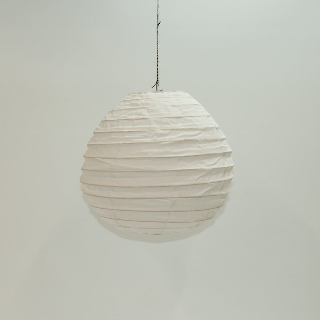 White Lila tear drop cotton lampshade. Designed by Woven. Handmade in Bangladesh.