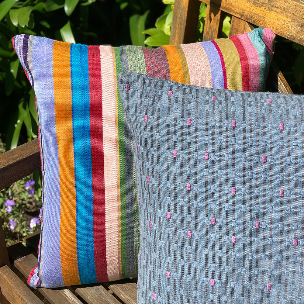 Meg Cushion. Grey and Pink with rain drop design made with 100% organic cotton and natural dyes. Designed by Woven. Handmade in Guatemala.